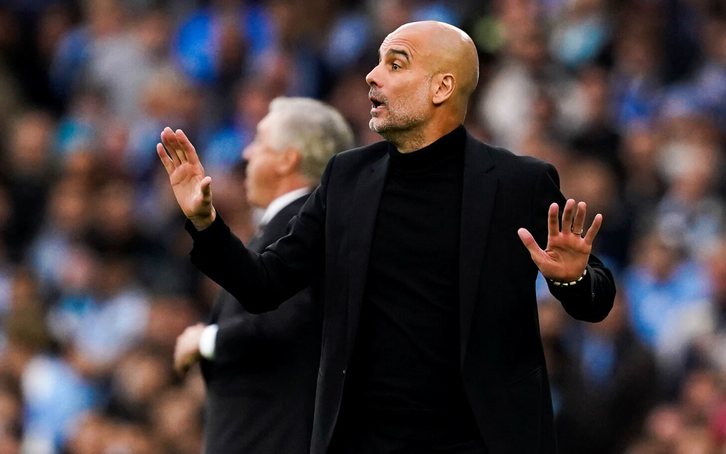 Jogadores do City comemorando enquanto Vini Jr. se lamenta. (Icon Sport) Jogadores do City comemorando enquanto Vini Jr. se lamenta. (Icon Sport)